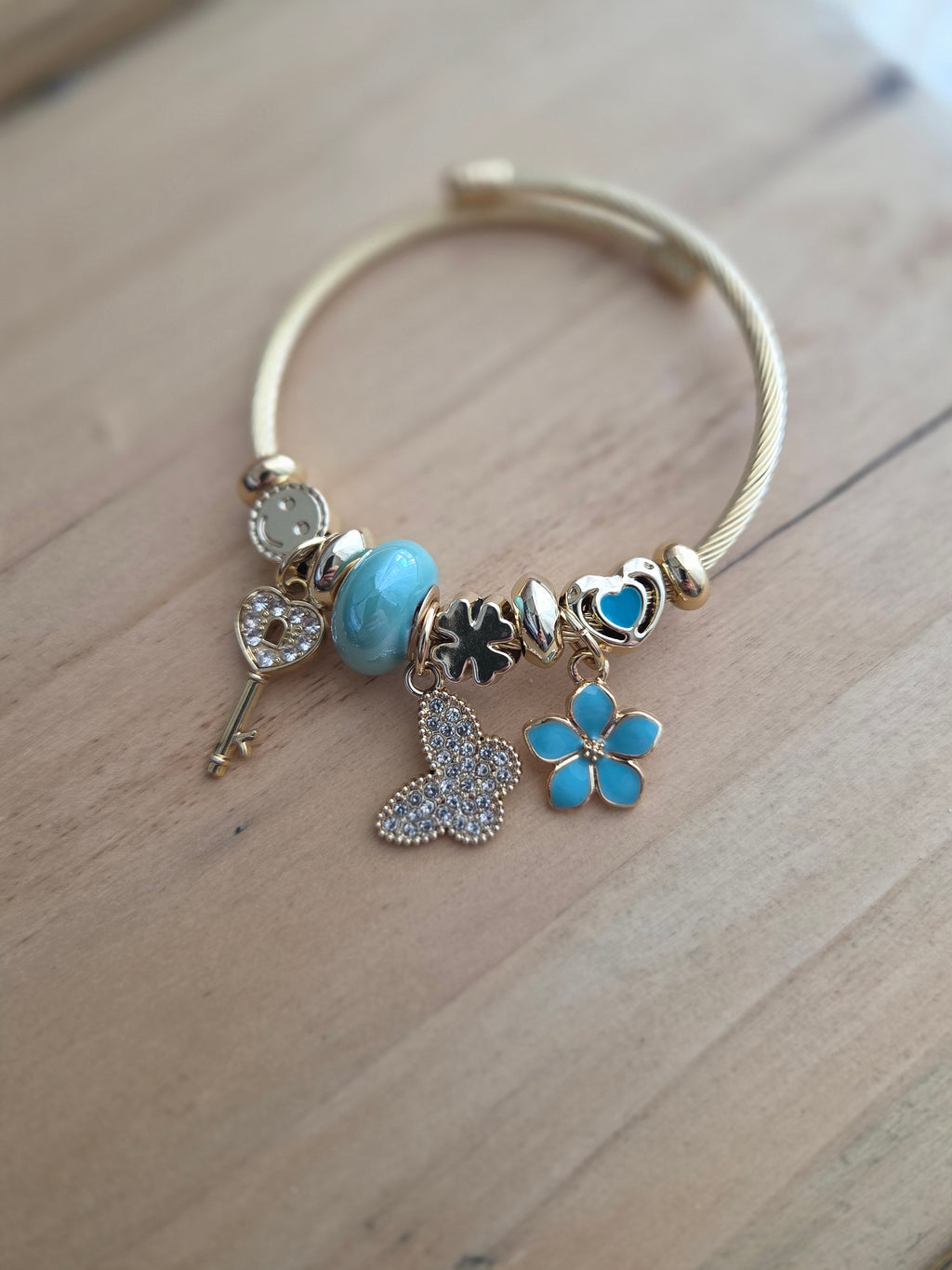 Jonc doré charms bleu