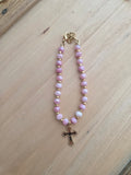 Bracelet doré rose croix