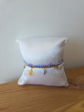 Bracelet doré perles bleues