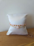 Bracelet doré perles roses